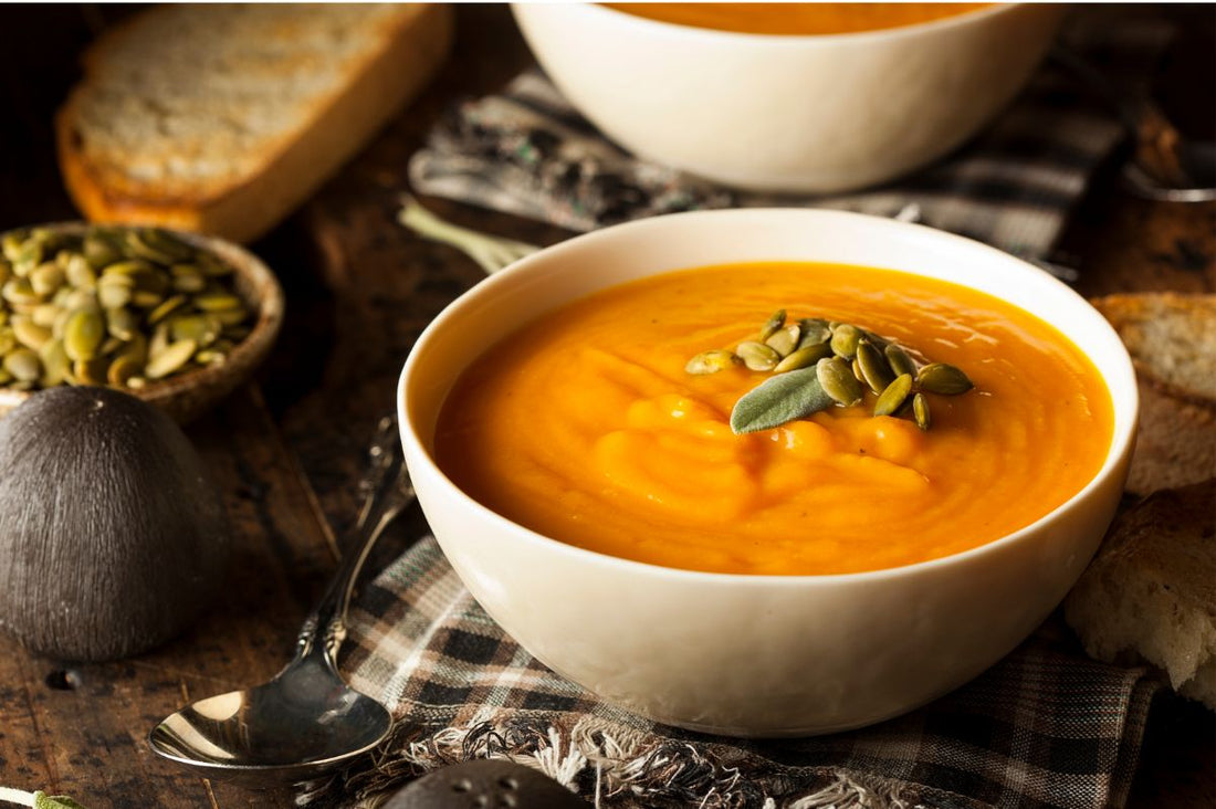 Bowl of organic, nutritious soup in a white bowl.