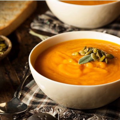 Bowl of organic, nutritious soup in a white bowl.