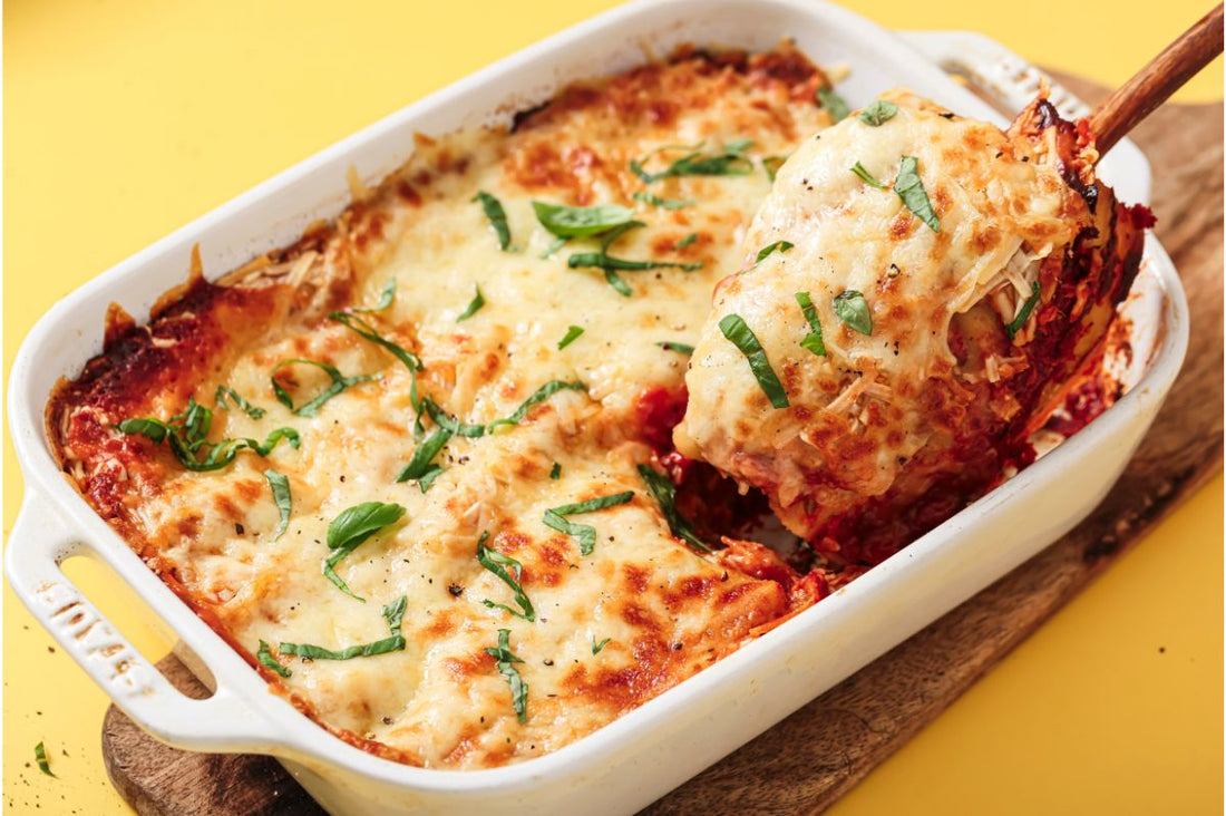 PACKD Vegan Spinach & Ricotta Cannelloni being spooned out of a white bowl