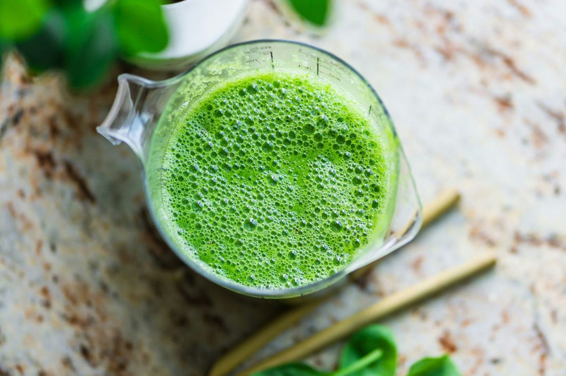 Jug with a gut healthy probiotic green smoothie, viewed from above.