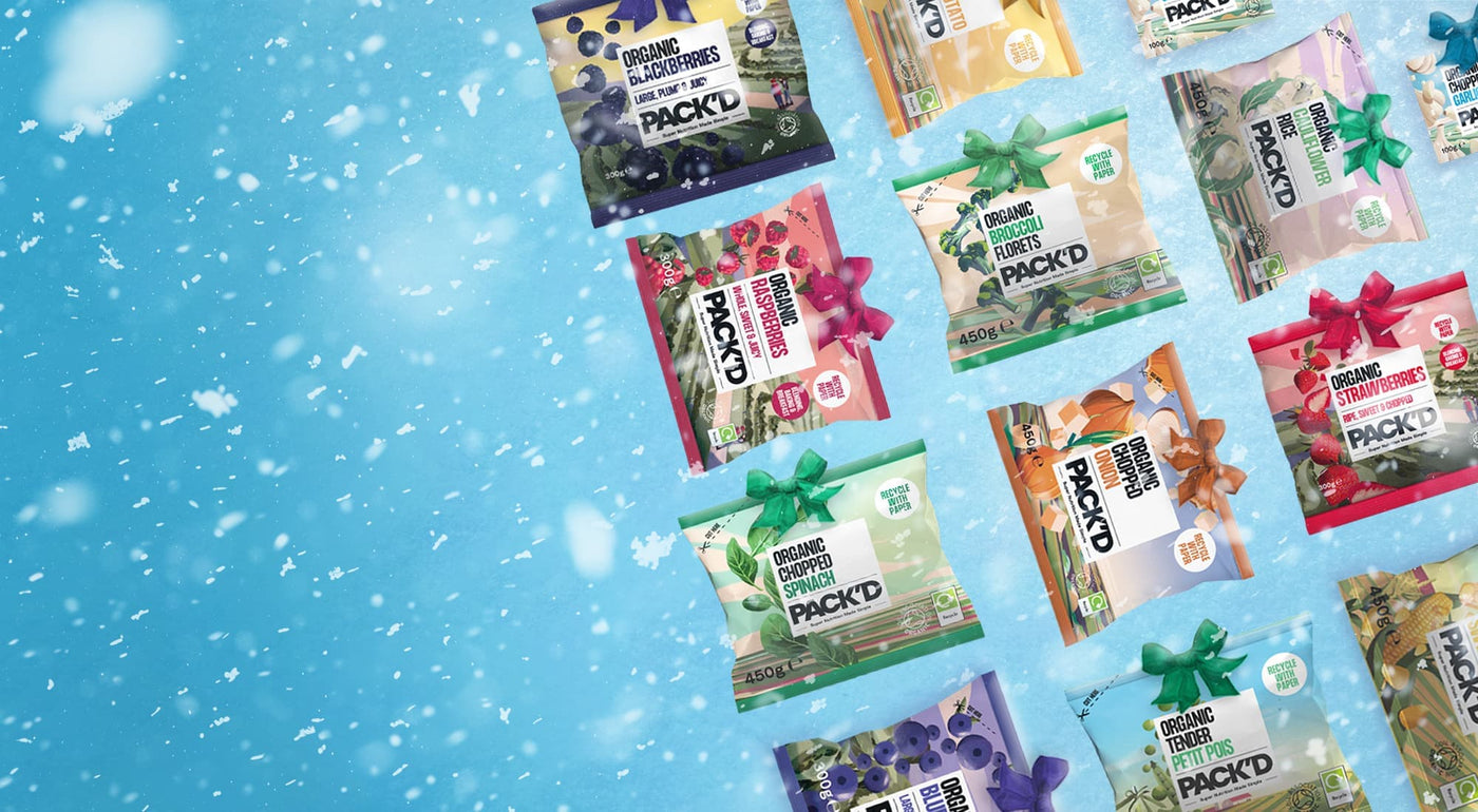 Pack'd Organic Fruit and Veg packs on a snowy blue background