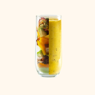 Recharge Smoothie Kit split view of fruits and smoothie in glass